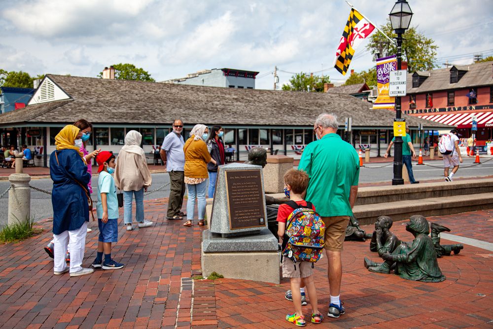 People admiring the Kunta Kinte-Alex Haley Memorial