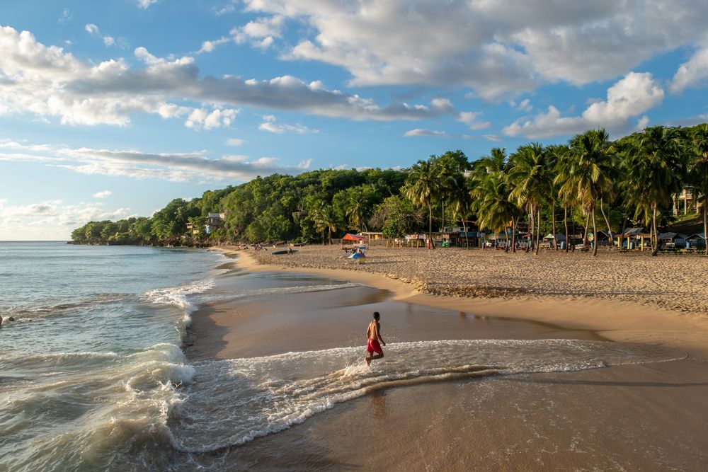 A person swimming on Crash Boat Beach
