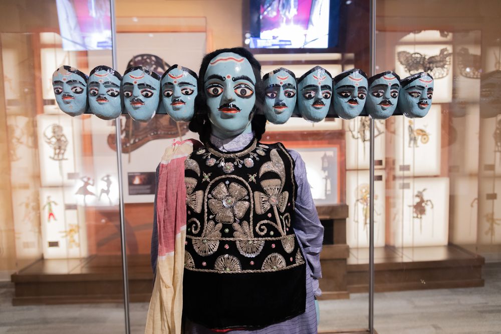 Person with many faces at Center For Puppetry Arts.