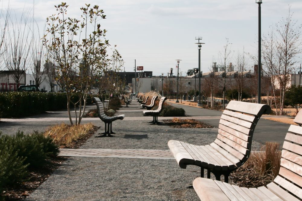 Wooden benches along Railroad Park