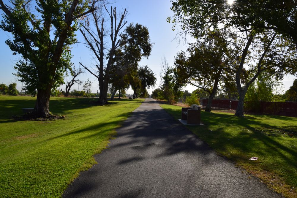 Kern River Parkway Trail lined with trees