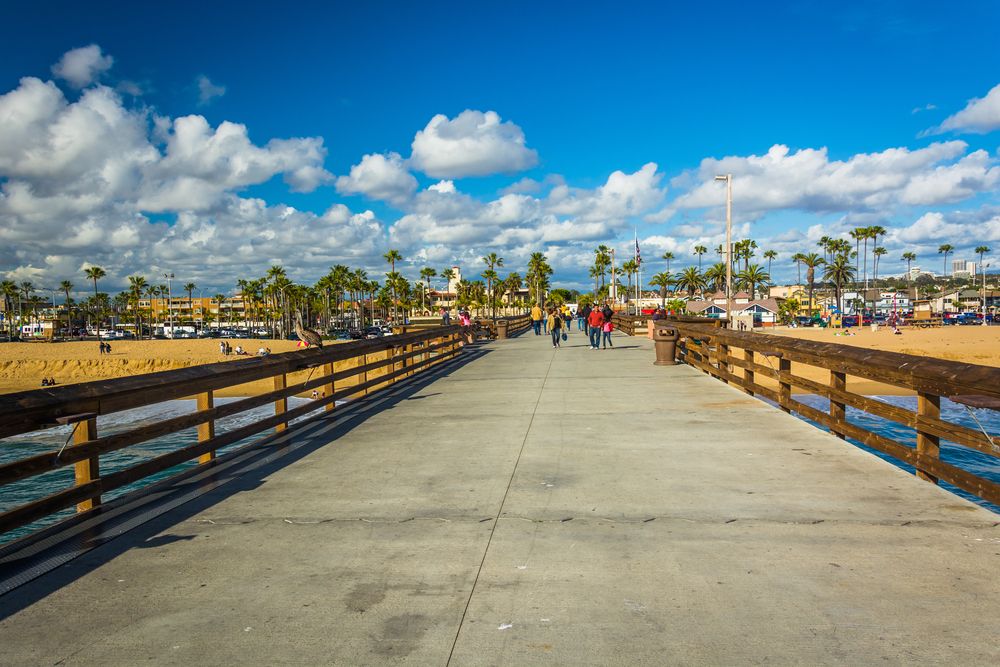 People walking along Balboa Pier