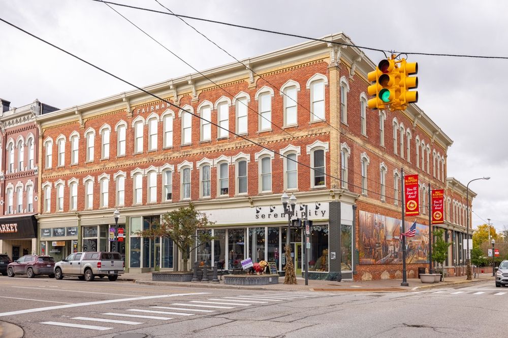 The brick building in downtown big rapids with a traffic light out front.