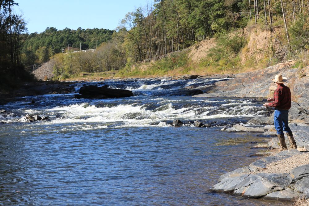 A man fishing for trout at Mountain Fork River