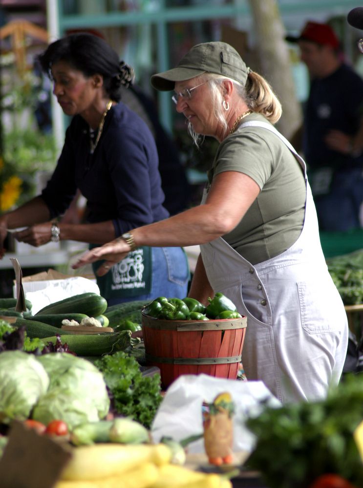 A woman shopping in Ann Arbor Farmers Market