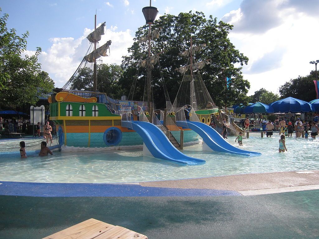A pool with waterslides at Schlitterbahn New Braunfels Waterpark Resort