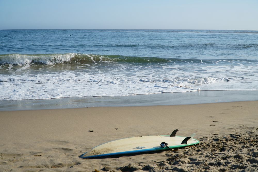 A surfboard on the shore of Capitola