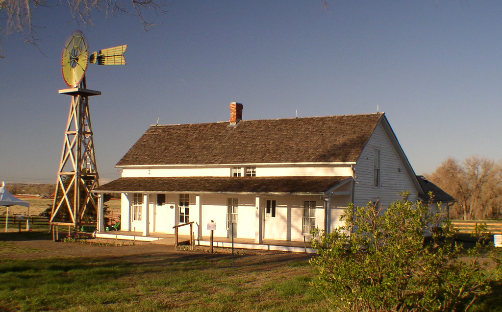 A house and windmill at 17 Mile House Farm Park