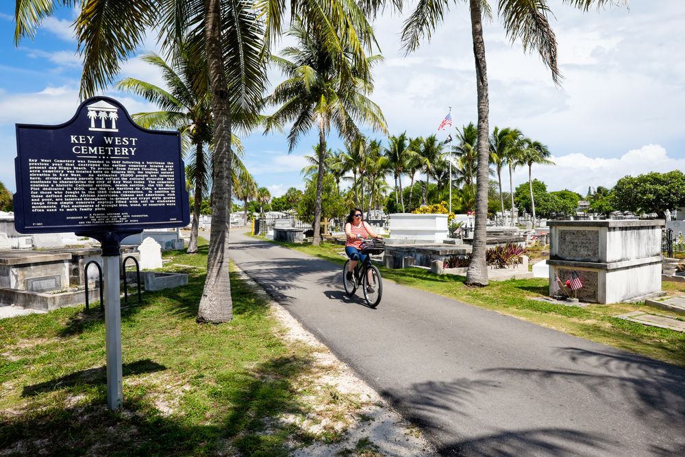 A Woman in Bicycle in Key West Cemetery