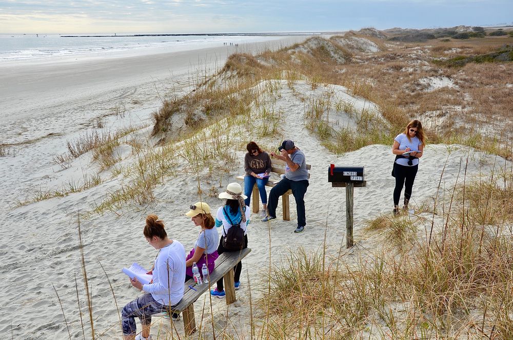People sitting on Kindred Spirit Mailbox's bench