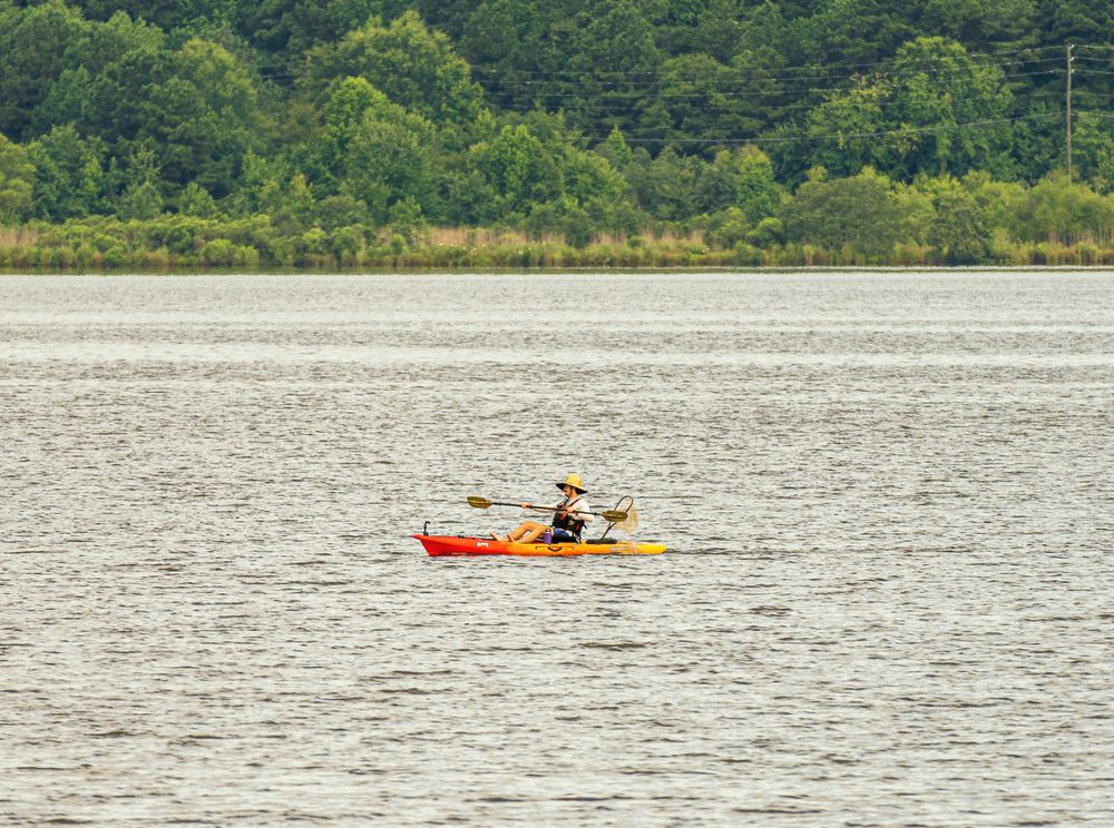 A person on a kayak at Lake Crabtree County Park
