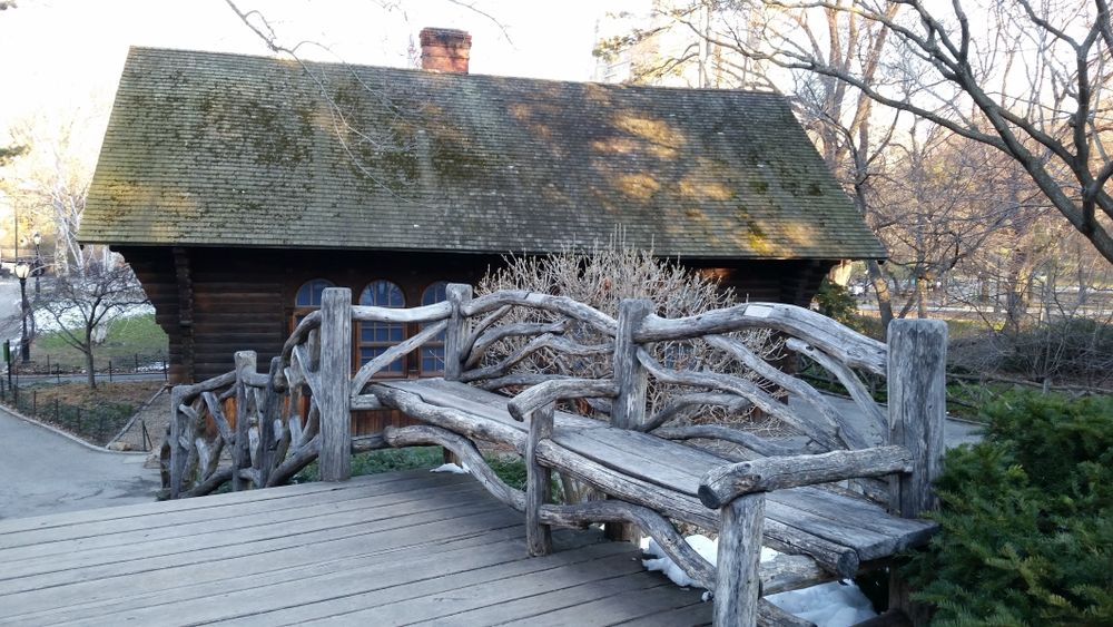 A wooden bench beside the Swedish Cottage Marionette Theatre