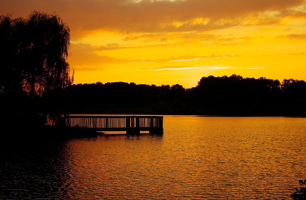 Breathtaking sunset over Cane Creek Park's lake