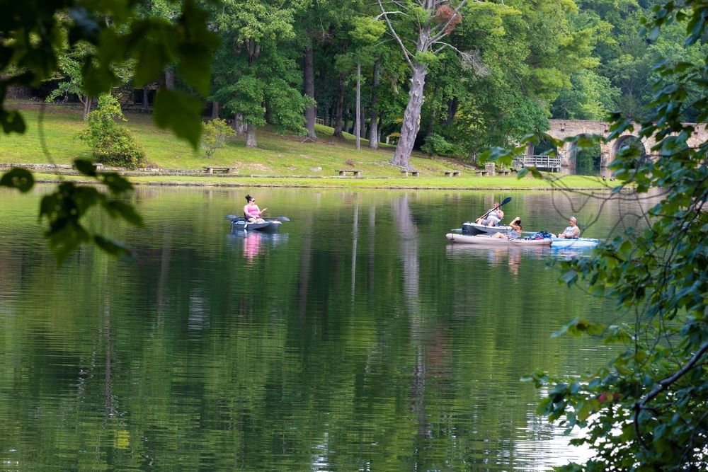 People boating on Cumberland Mountain State Park's byrd lake