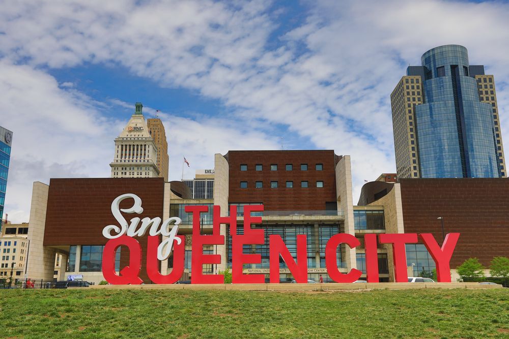Close view of the Sing the Queen City sign