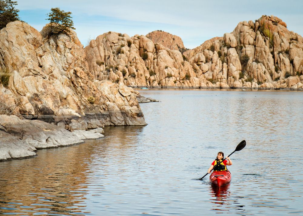 A woman kayaking on Watson Lake