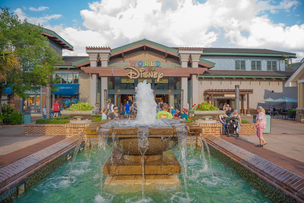 A water fountain in front of World of Disney Store