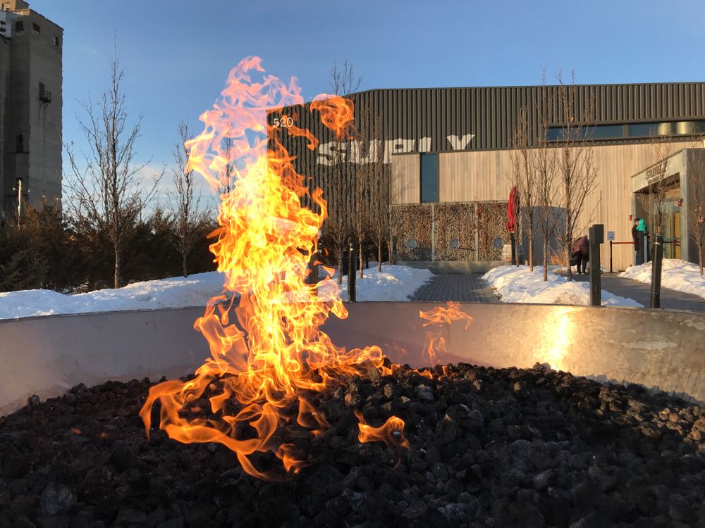 Fire outside the Surly Brewing Company to keep the customers warm
