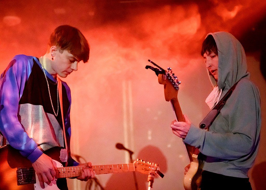 Two people playing the guitar at The Echo & Echoplex.