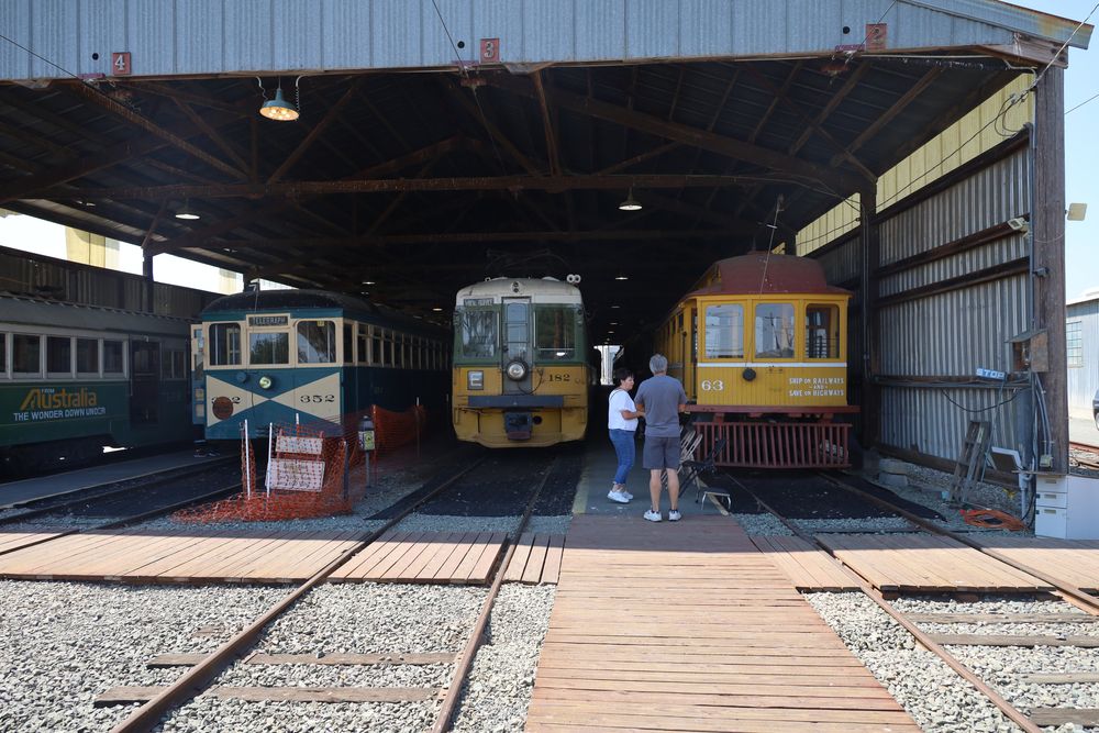Two people looking at the trains at Western Railway Museum