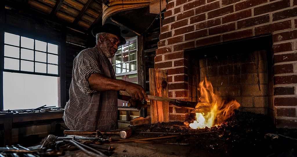 A blacksmith at the historic Westville