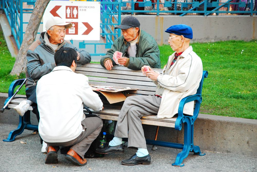 Elderly people playing cards at Portsmouth Square
