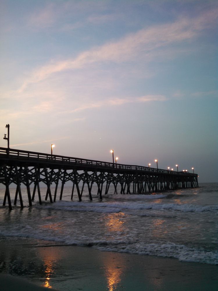 Silhouette of the Surfside Pier during sunset