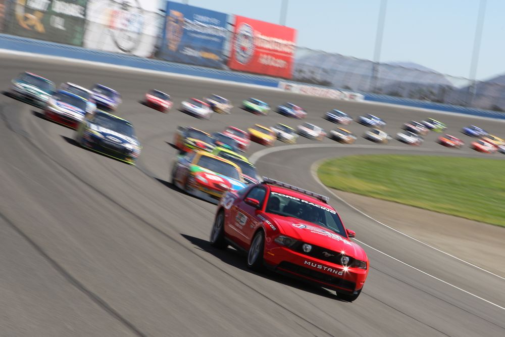 Race cars along Auto Club Speedway