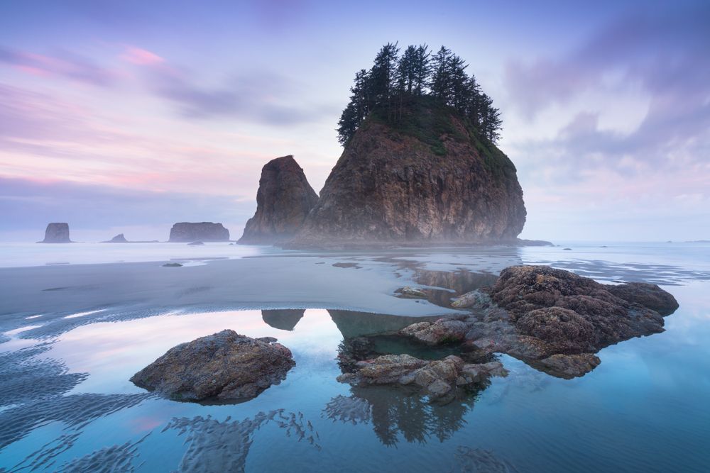 Scenic view of the second beach waters and rocks - during a sunset