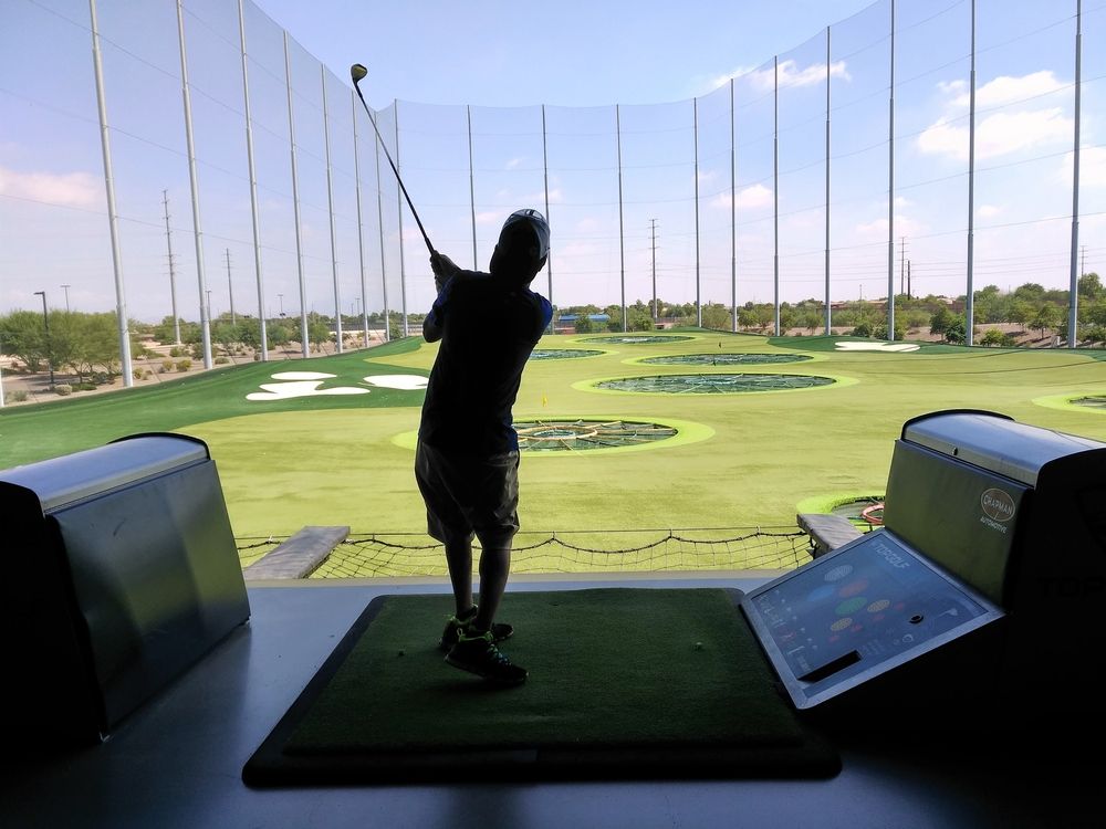 A person playing golf at Topgolf