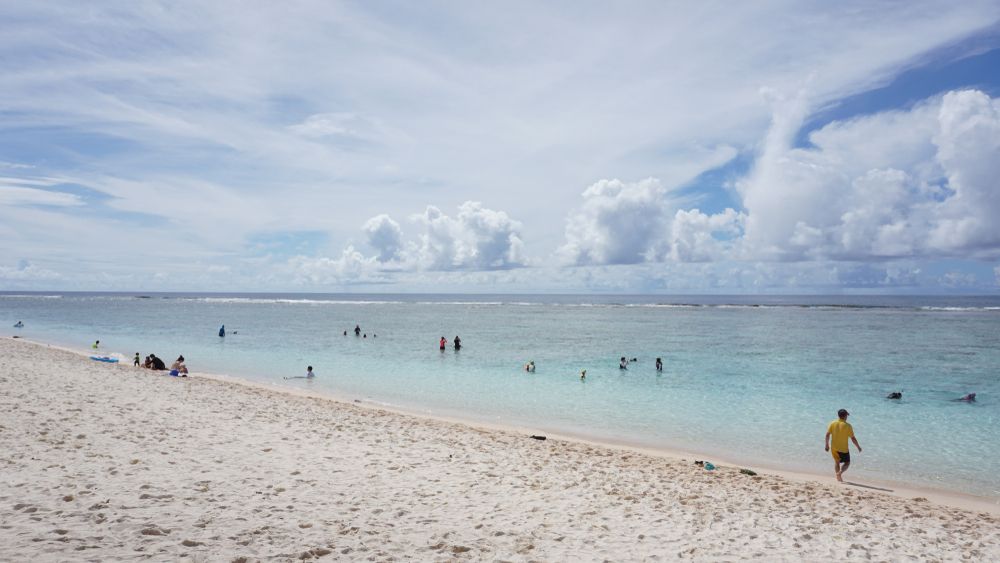People swimming on the waters of Ritidian Point