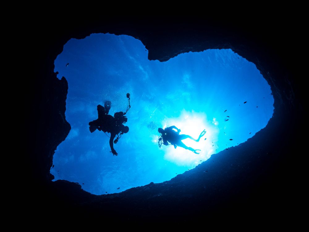 Silhouette of scuba divers in Guam