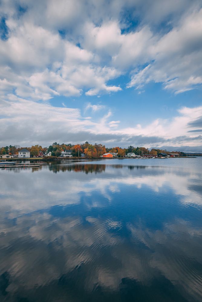 The sky reflecting on Moosehead Lake's calm water