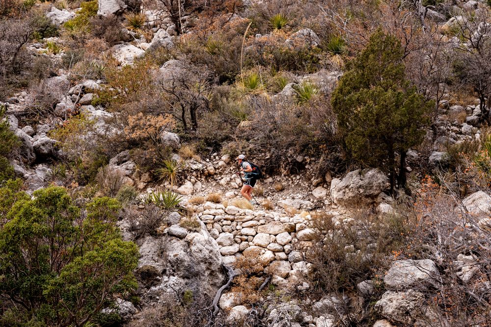 A hiker climbing up Guadalupe Peak Trail