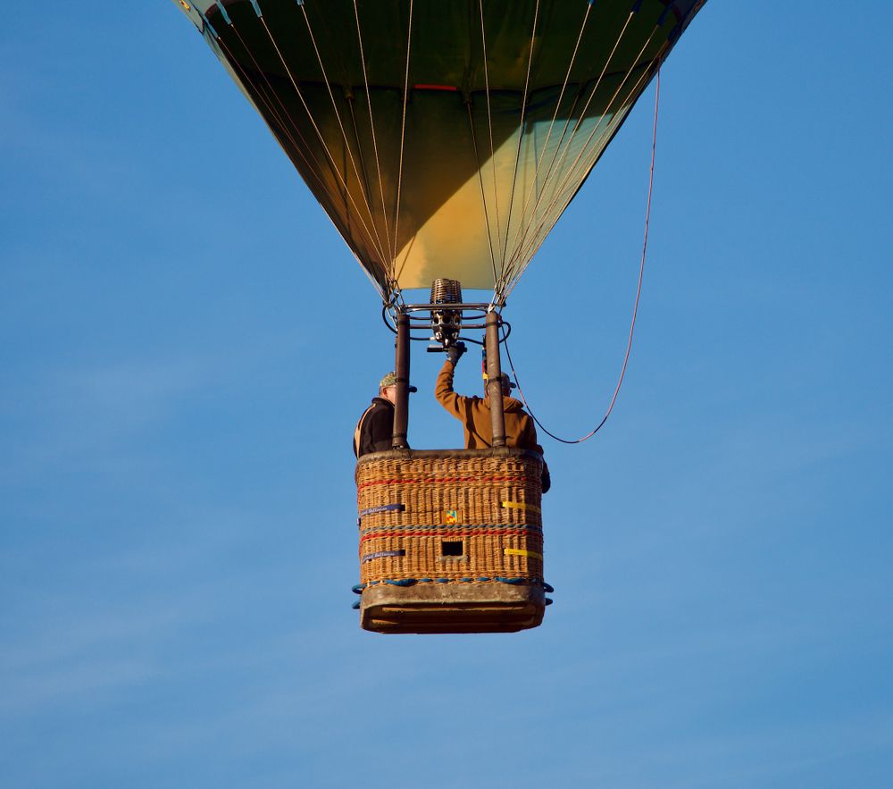 People on a hot air balloon during Balloon Rally