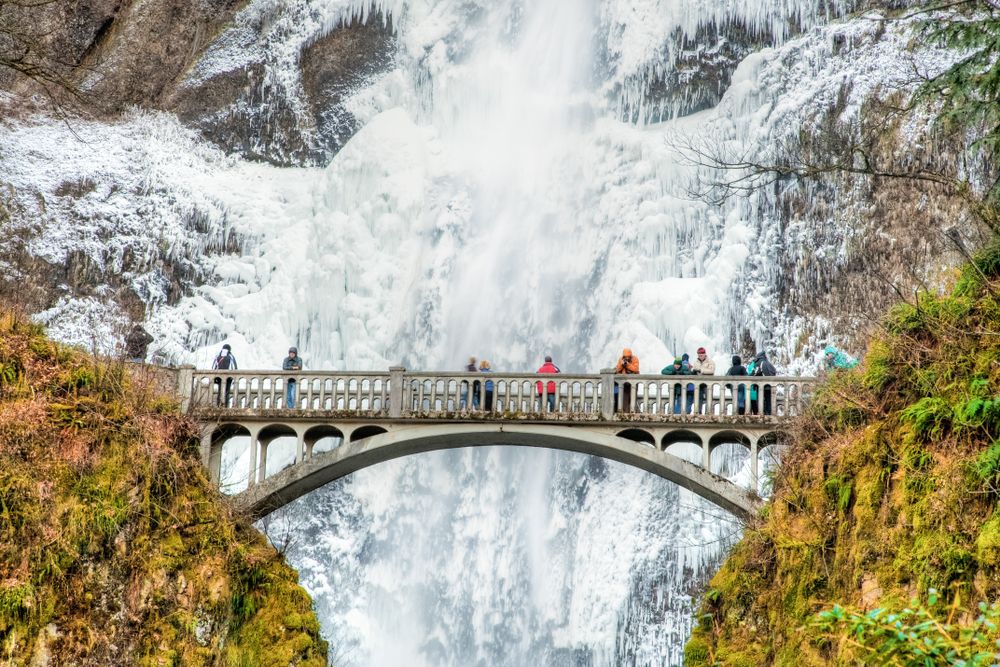 People on the Multnomah Falls' footbridge