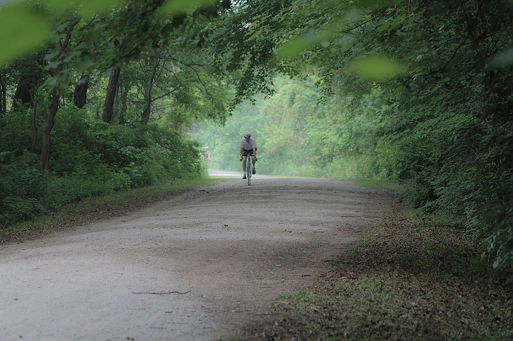 A person riding a bike along Pumpkinvine Nature Trail