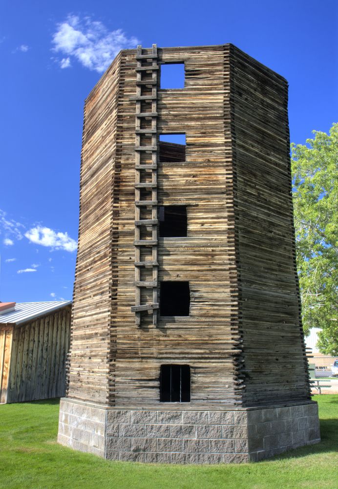 A seven sided wood silo at Centennial Village museum.