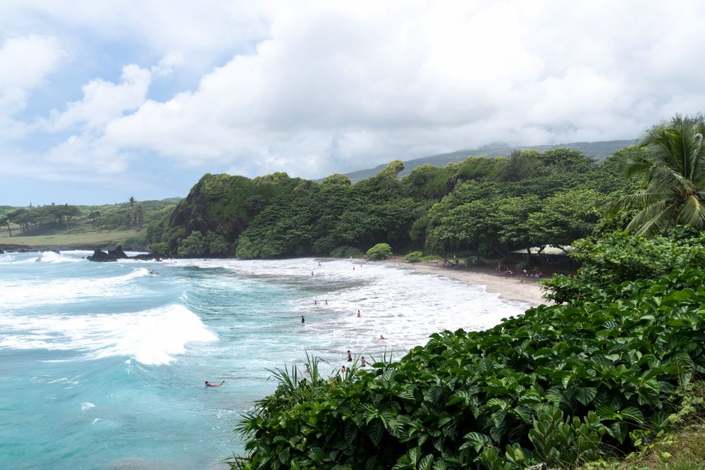 People enjoying the Hamoa Beach's waves