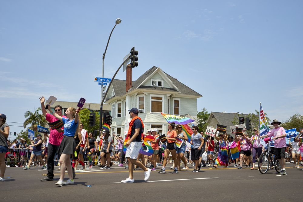 People with pride flags during the Annual Pride Celebration