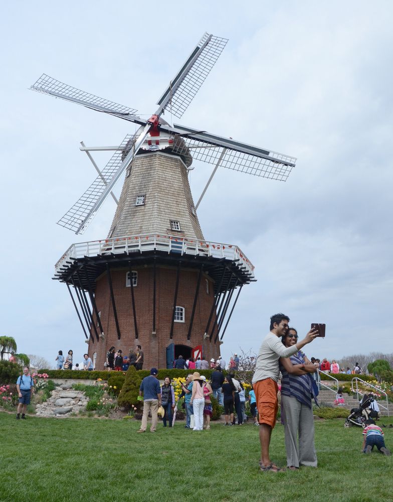 People admiring a windmill at Windmill Island Gardens