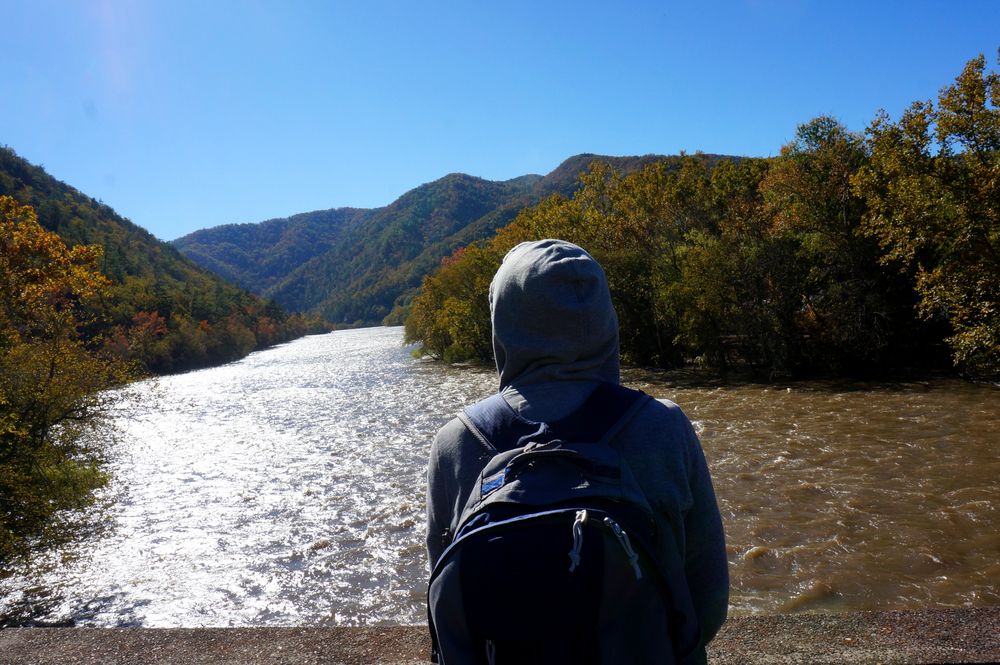 A person admiring the French Broad River
