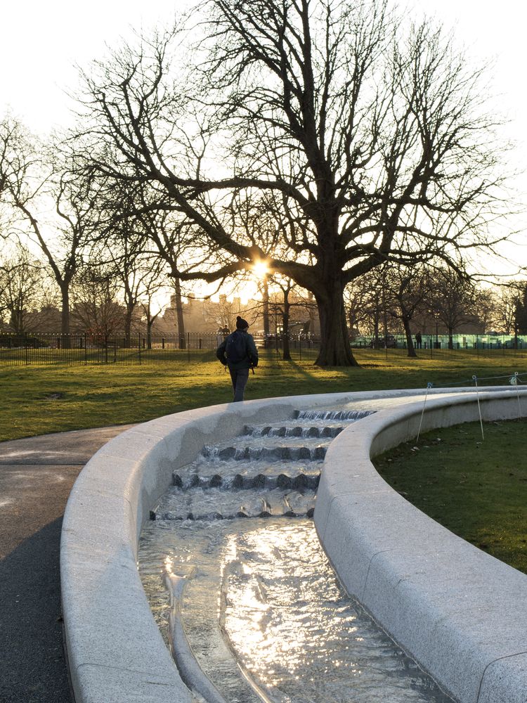 Person walking by Diana Memorial Fountain