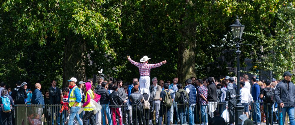 People listening to a public speaker at Speakers' Corner