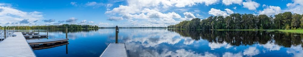 Blue skies reflecting on a lake at Wallace Brooks Park