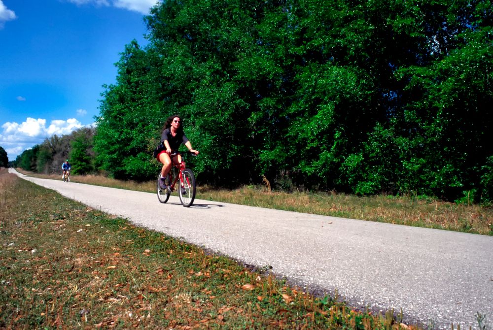 Two people riding their bike at Withlacoochee State Trail