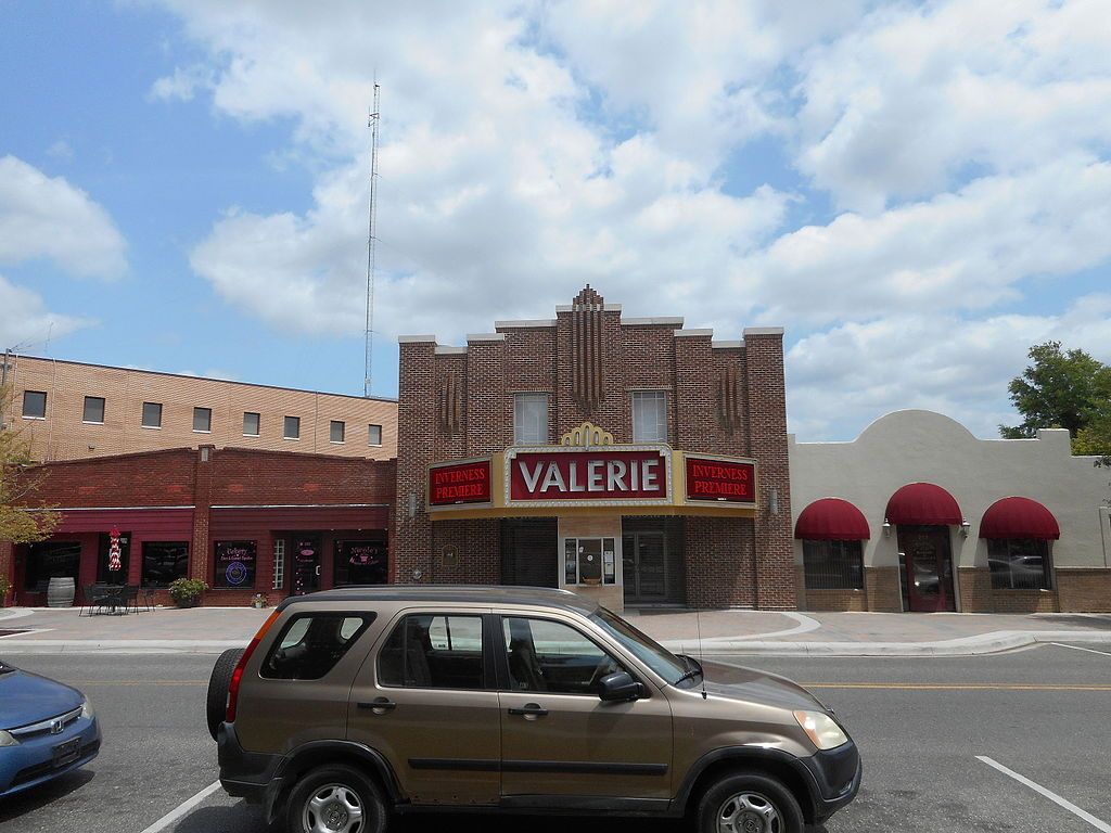 A car parked in front of the Valerie Theater