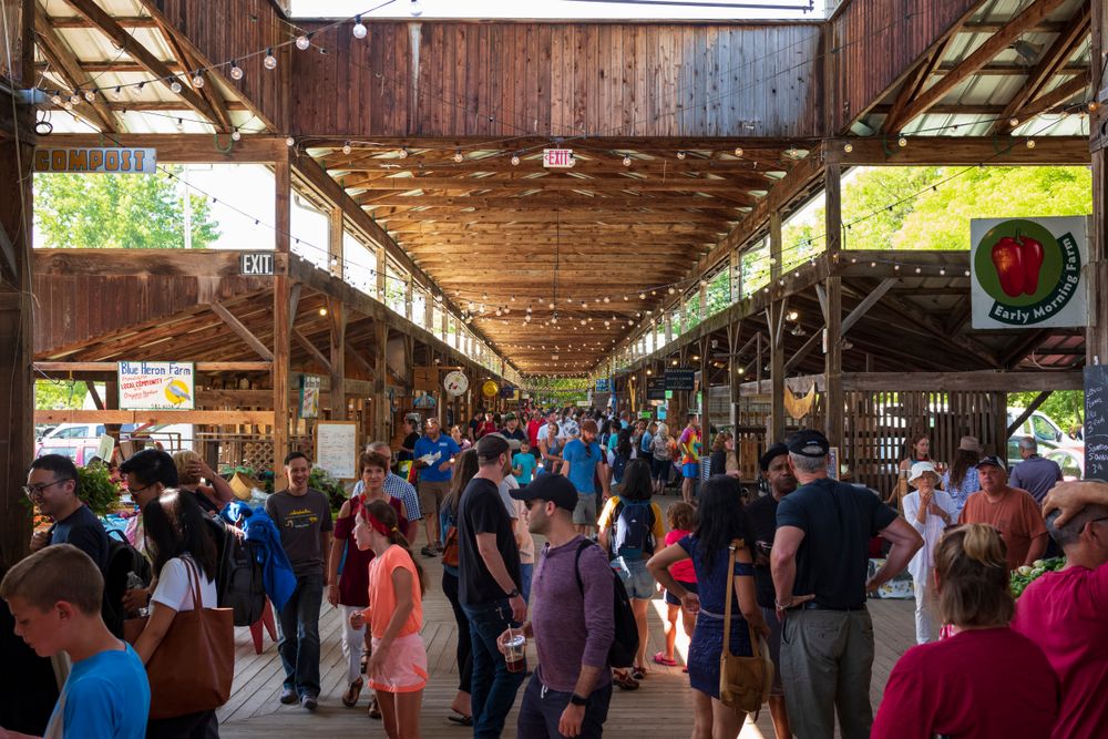 People shopping inside the Ithaca Farmers' Market