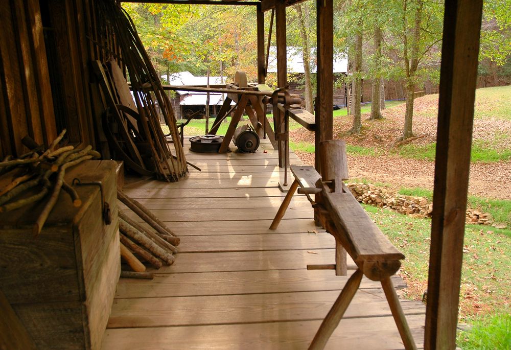 Porch with wood and tools at Jarrell Plantation State Historic Site