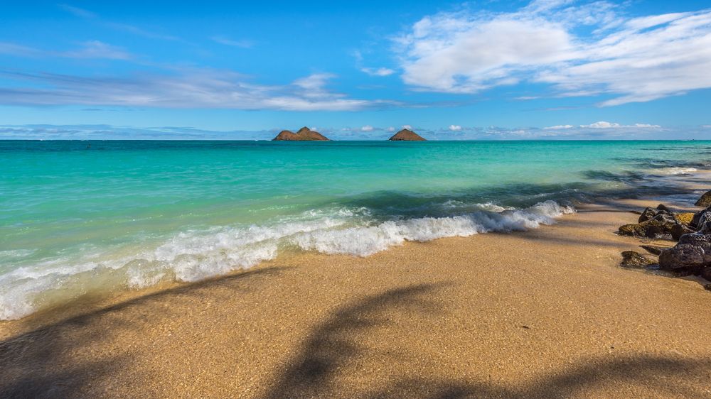 Calm waves crashing at Lanikai Beach shore